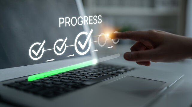 Digital Progress Indicator on Laptop Screen with Hand Touching Progress Bar and Checkmarks in a Modern Workspace Setting. Bitwise.