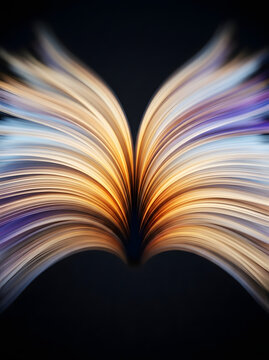 Abstract open book with colorful light trails and blurred pages artistic presentation