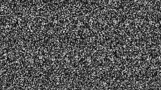 Grainy television static noise Black and white television static noise texture with grainy monochrome pixels creating a chaotic visual effect for retro broadcast signal interference