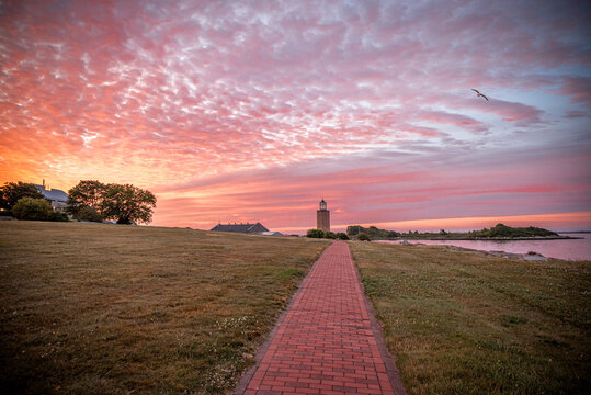 Groton, Connecticut, USA - Brick Walkway Leading To Avery Point Lighthouse At Sunrise