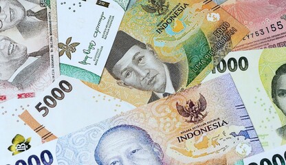Indonesian rupiah money bills in pile on table. Indonesia IDR currency cash close up © Viktor