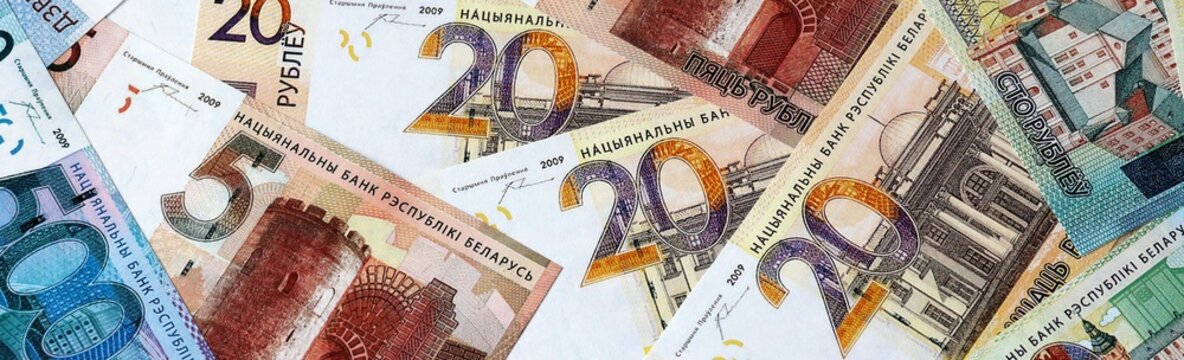 Belarusian ruble money bills in pile on table. Belarus BYN currency cash close up