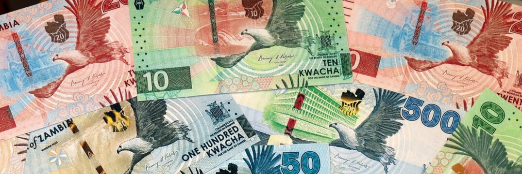 Zambian kwacha money bills in pile on table. Zambia ZMW currency cash close up