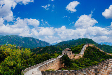 Fototapeta premium Great wall stretching along mountainous ridge under blue sky in Beijing China