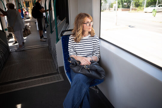 Portrait of mature woman on public transport