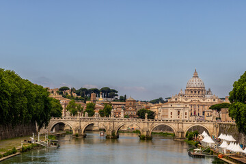 Fototapeta premium Famous tourist attraction and panoramic view of the Saint Peter`s basilica and the Vatican city architecture in Rome, Italy