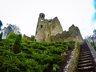 Historic medieval fortress of Blarney castle near the city of Cork Ireland surrounded by green gardens © Vlad Ispas