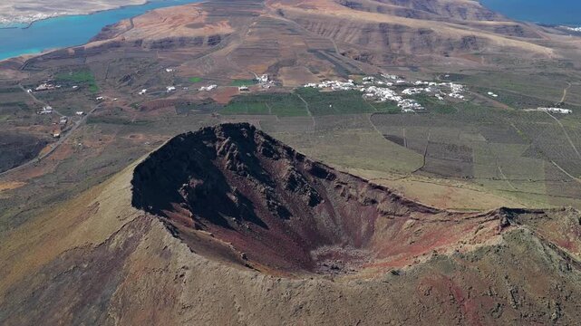 Aerial flyover above Volcan Corona Crater in Lanzarote - Volcanic Activity and Eruptions in the Canary Islands