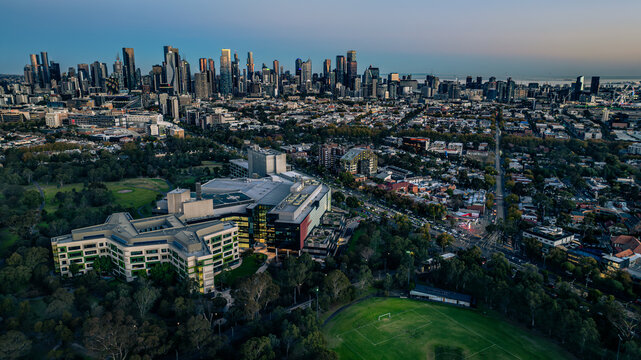 Aerial view of The Royal Children's Hospital Melbourne surrounded by lush parklands with the Melbourne city skyline in the background Parkville, Victoria, Australia.