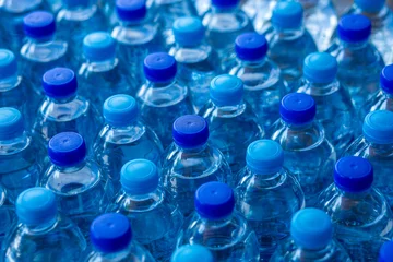 Fototapeten Musik Row of plastic water bottles  © solidmaks