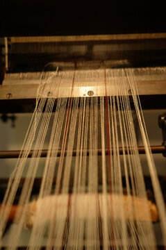 Threads in a loom, close-up