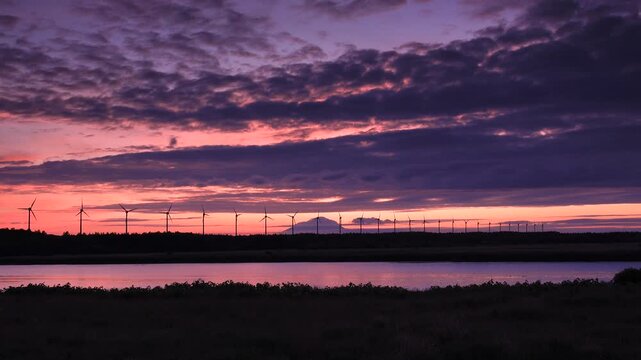 利尻島と天塩川と風力発電の夕景