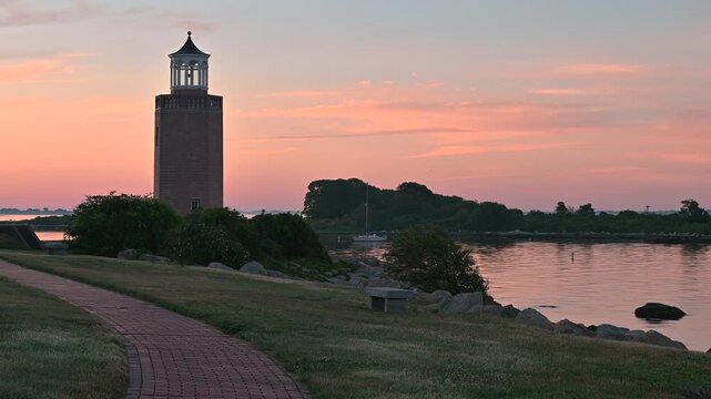 Groton, Connecticut, USA - Curved Brick Walkway Leading To Avery Point Lighthouse At Sunrise