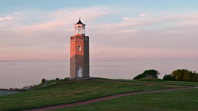 Groton, Connecticut, USA - Low Angle View Of Avery Point Lighthouse At Sunrise