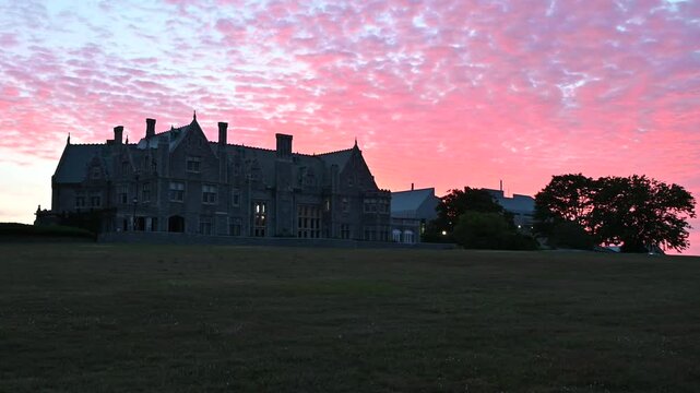Groton, Connecticut, USA - Branford House Mansion Beneath Dramatic Sunrise Clouds At Avery Point