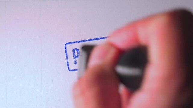 Blue "PASSED" stamp applied directly onto official document profile to show approval.