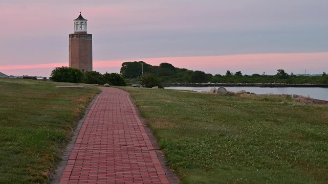 Groton, Connecticut, USA - Brick Path Leading Toward Avery Point Lighthouse At Dawn