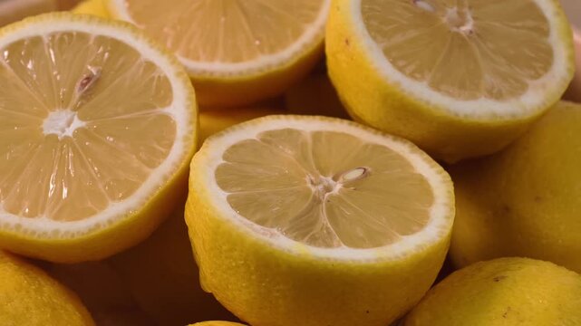 Close-up display of halved fresh yellow lemons