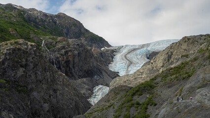 Fototapeta premium Exit Glacier Emerging Through Low Clouds in Kenai Fjords National Park, Alaska