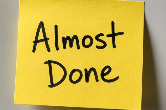 Yellow sticky note with handwritten almost done message