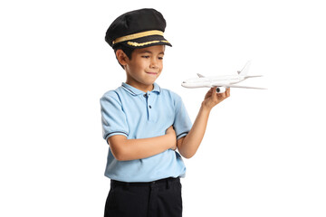 Kid wearing a pilot hat and playing with an airplane © Ljupco Smokovski