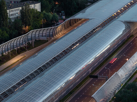 Aerial view of the Torunska route with its distinctive glass-covered sound barriers and multi-lane highway in Warszawa, Mazowieckie, Poland.