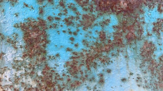 Background of abstract colour blue with texture rust on boat Natural distress on paint surface when exposed to the elements close up moving shot UK 4K