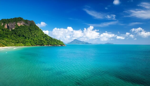 Blue Ocean With A Green Shoreline And A Mountain In The Background Pantai Kok Langkawi Malaysia