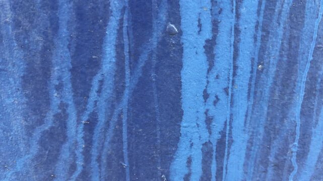Background of abstract colour blue with texture rust on boat Natural distress on paint surface when exposed to the elements close up moving shot UK 4K