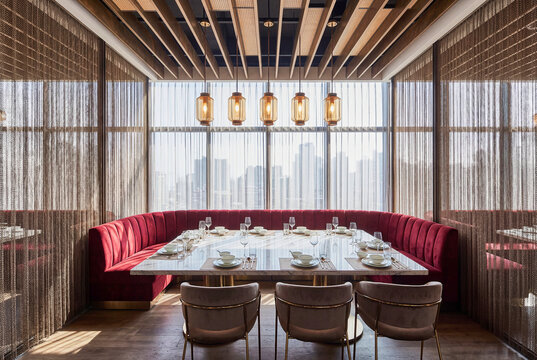 Luxury private dining room with elegant table setting and warm light