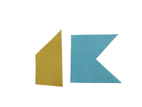 Two geometric paper shapes in gold and blue color isolated on a plain surface for creative design work isolated on transparent background