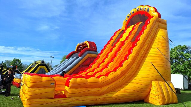 Inflatable slides are set up for a Toronto festival