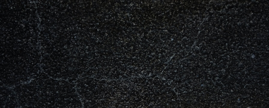 Black granite texture background, dark polished marble stone surface, elegant charcoal mineral grain for luxury interior design backdrops