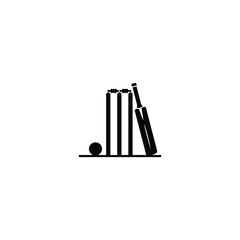 Obraz premium Cricket bats and ball on a flat surface with stumps