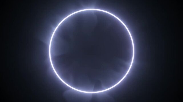 Glowing neon blue circle ring light on dark background