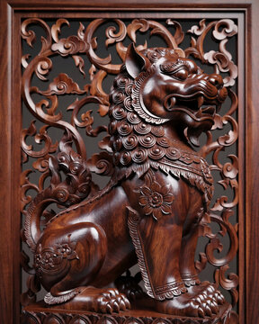 An ornate wooden carving of a traditional Chinese foo dog guardian lion featuring a glossy finish and detailed Asian craftsmanship on a decorative backdrop.