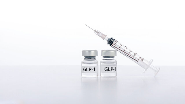 Hopeful medical setup featuring glp1 vials and syringe offers modern weight loss solution representing healthy lifestyle change