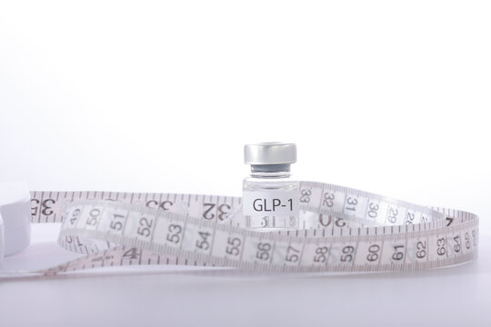 Hopeful health journey showing medical vial wrapped in measuring tape representing weight loss diet treatment with modern glp1 medicine
