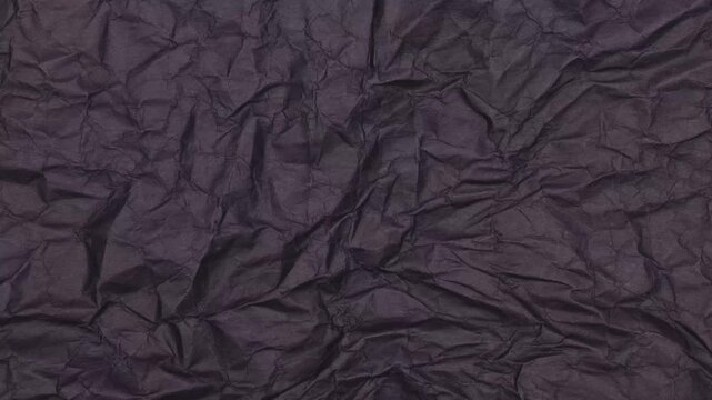 Crumpled Black Craft Paper Background Texture. Animated Crinkled Black Paper Texture. Great as Dramatic, Moody Backdrop for Graphic Design, Product Mockups and Luxury Packaging Concepts.