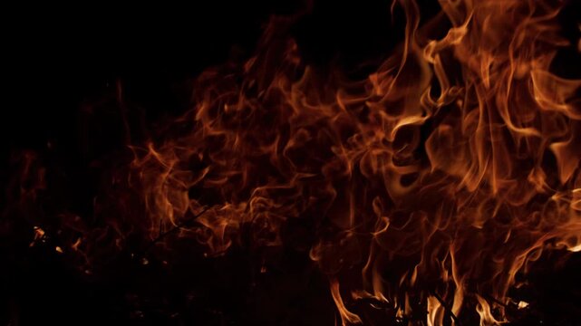 Fire blazing intense flames. Fire burning slow motion style. Fire glowing cinematic warmth. Fire background for VFX.