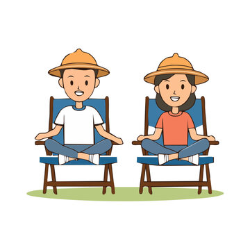 Two people relaxing in deck chairs with straw hats