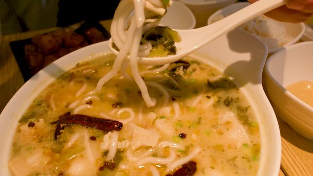 Spicy Chinese Noodle Soup with Fish Balls and Chili Peppers