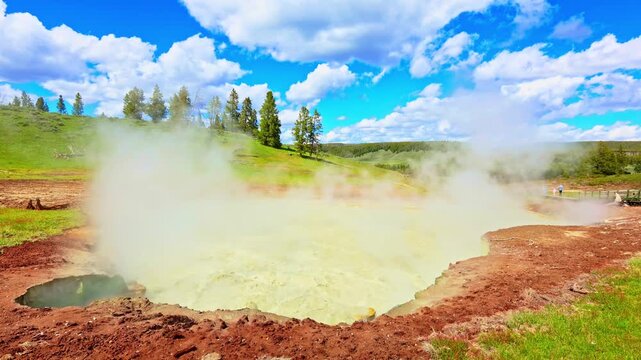 Steam rises from Churning Caldron at the Mud Volcano Area in Yellowstone National Park