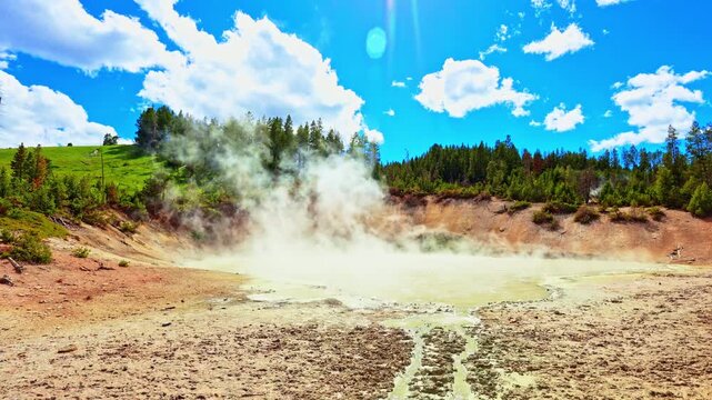 Steam rises from Churning Caldron at the Mud Volcano Area in Yellowstone National Park