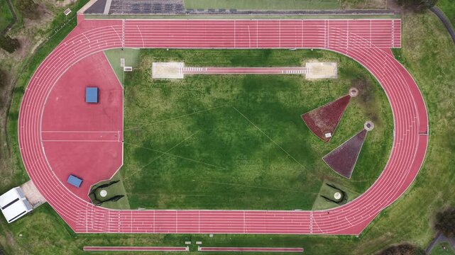 Aerial top down view of empty athletic running track