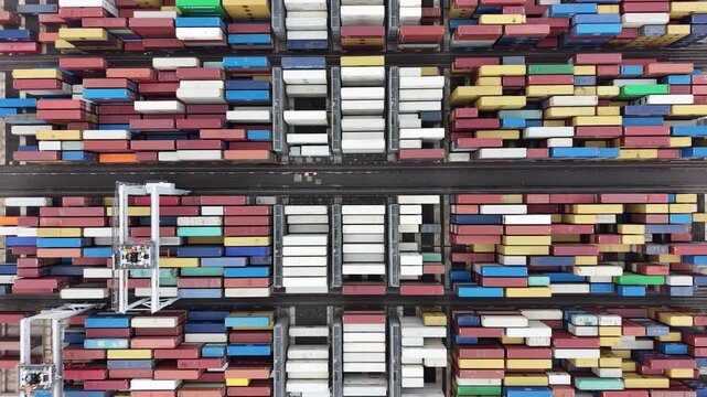 Aerial top down view of shipping containers in an industrial port