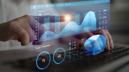 A professional working on a laptop, engaging with a modern analytics dashboard showcasing real-time data, metrics, and performance insights for informed decision-making. Impute