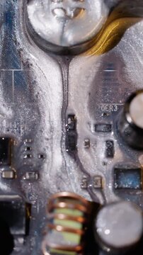Vertical video. Neon dye spill. Electronic technology. Defocused blue white purple color microcircuit sparkling round bright fluid on abstract background.