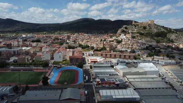Aerial view of the town of Castalla with its castle, the industrial estate and the municipal sports center. Spain.