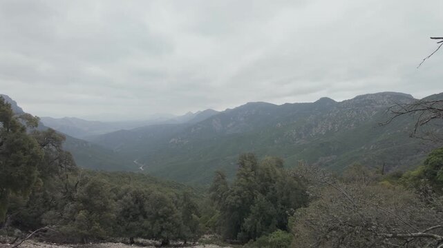 Panoramic mountain valley view above forested slopes in Gorropu Canyon Sardinia